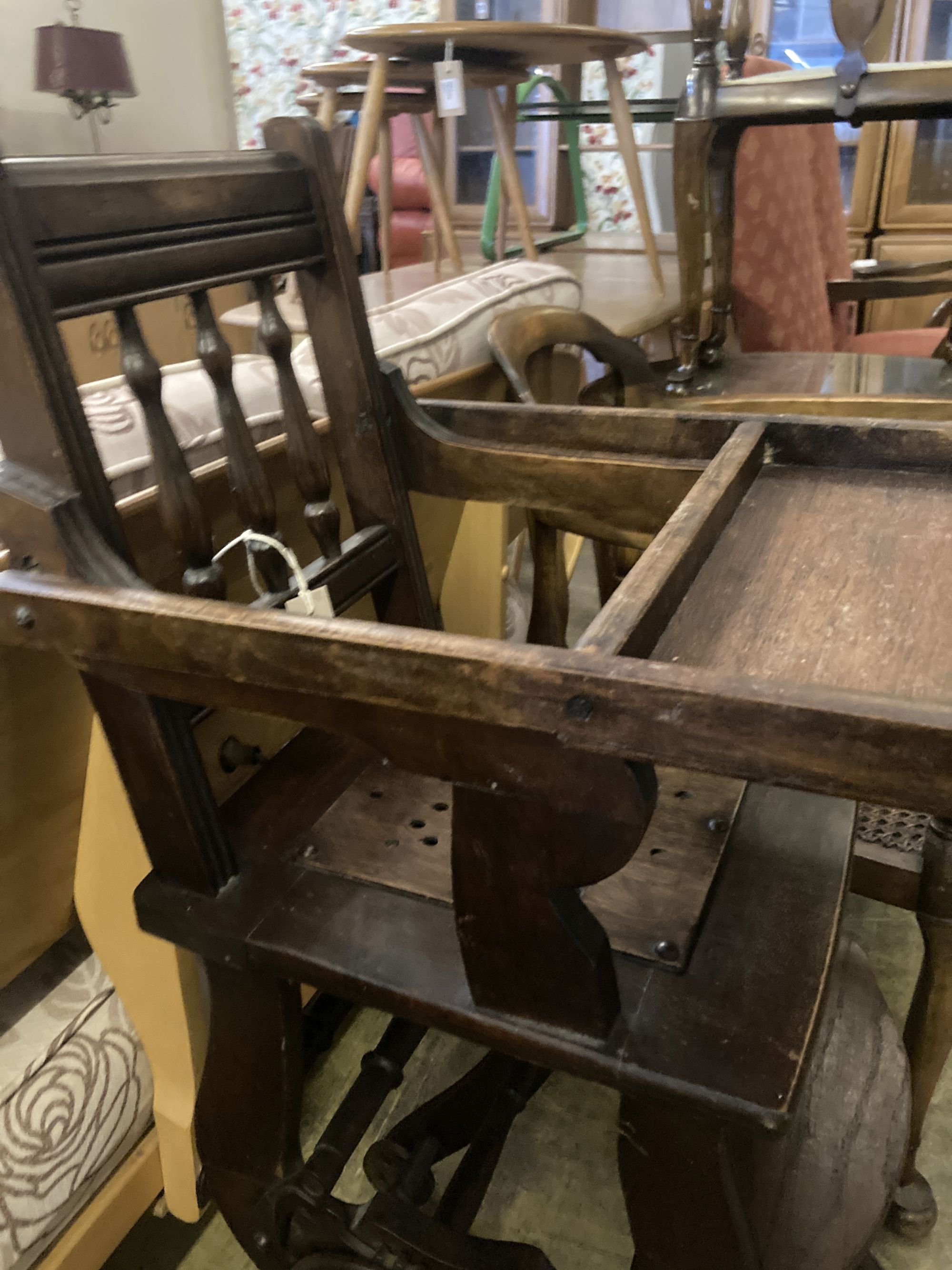 An early 20th century oak and beech childs metamorphic high chair